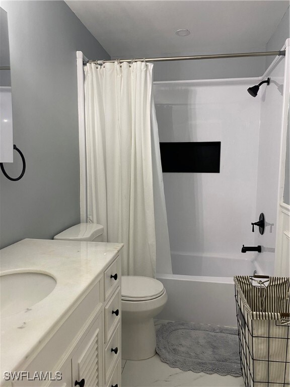 Full bathroom featuring vanity, shower / bath comb