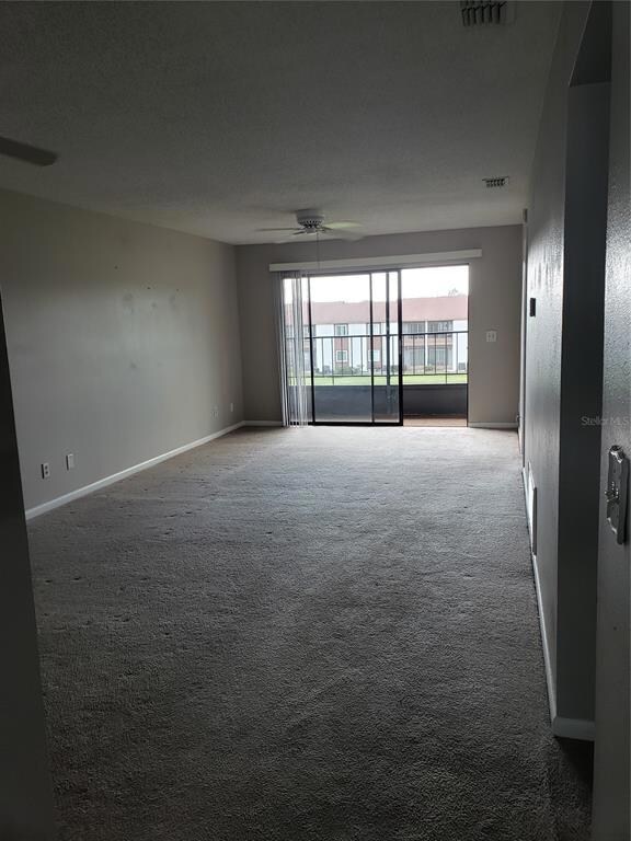 Standing by the Kitchen, a view of the Dining/Living Room