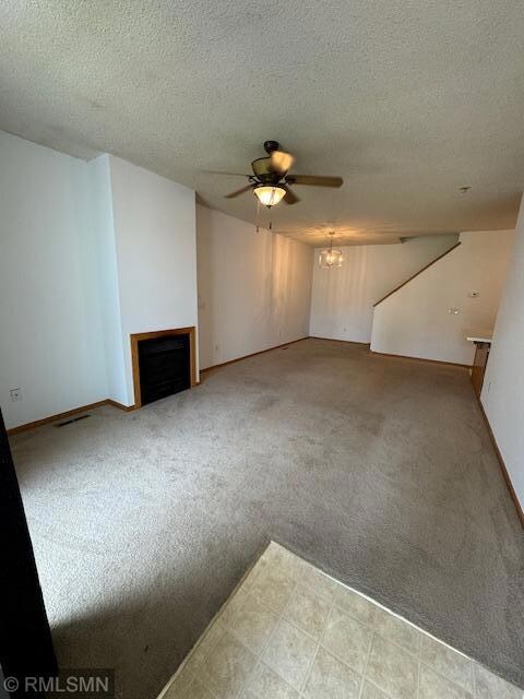Bright and open living and dining room with cozy gas fireplace