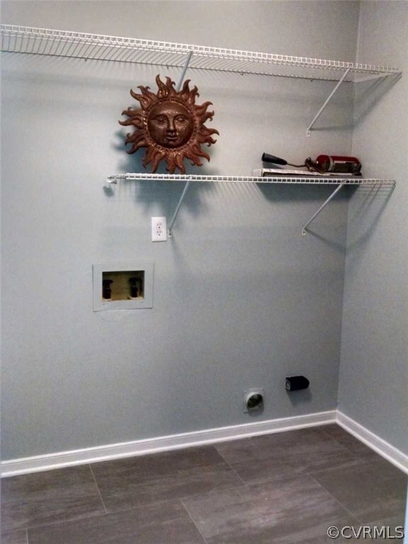Laundry room. Freshly painted. Shelving. New vinyl