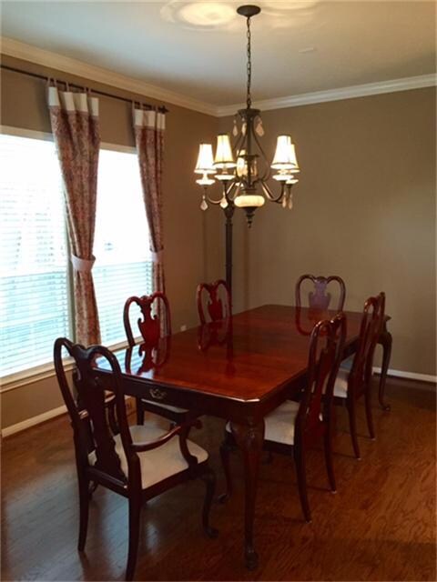Formal dining with wood floors, windows bring in lots of natural light. Host your holiday parties here!