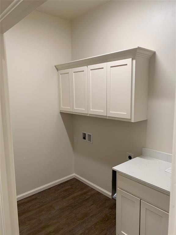 Clothes washing area with dark wood-style floors, 