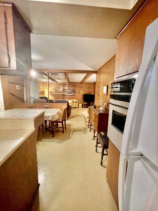 Kitchen looking into dining and family room