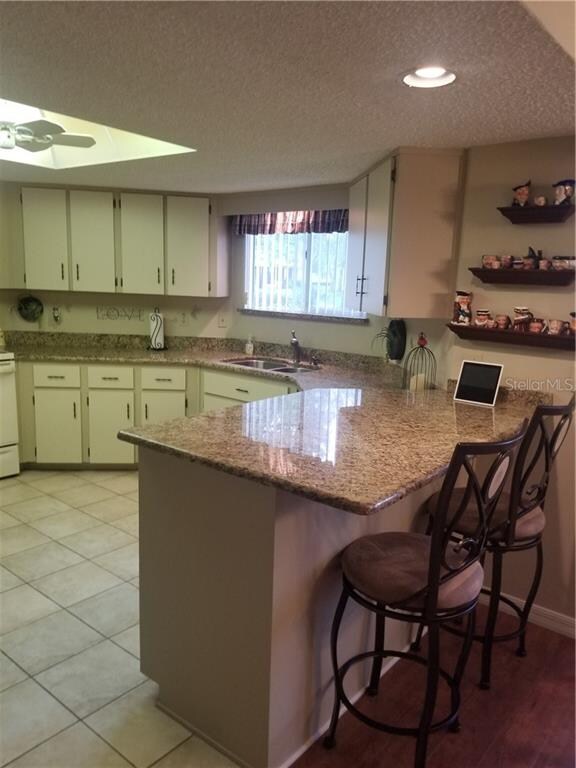 Plenty of cabinets and granite counters.