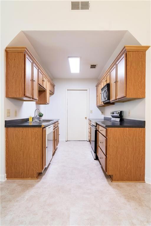 Kitchen features a new range.