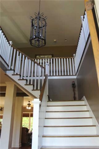 The stairs led you to the landing where there are 2 bedrooms, 2 unfinished walk in attics and an excellent space for a library. 
