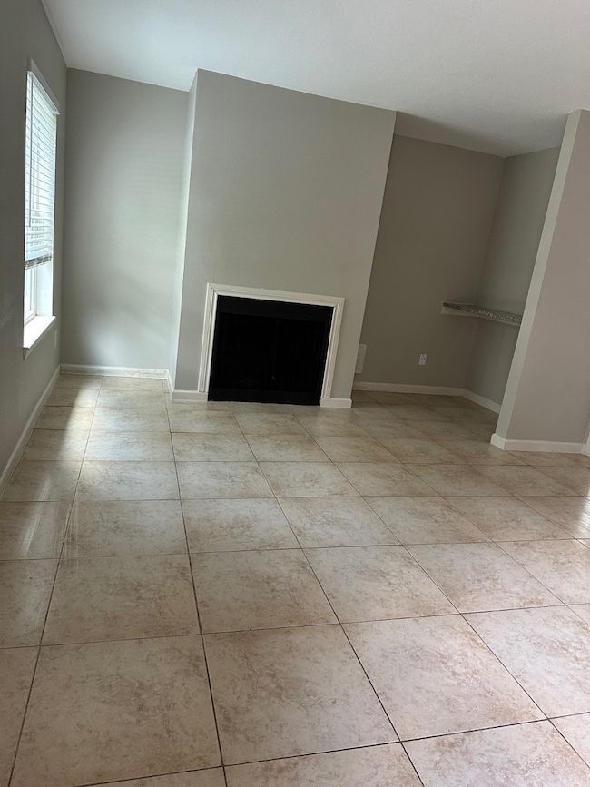 fireplace and all tile flooring