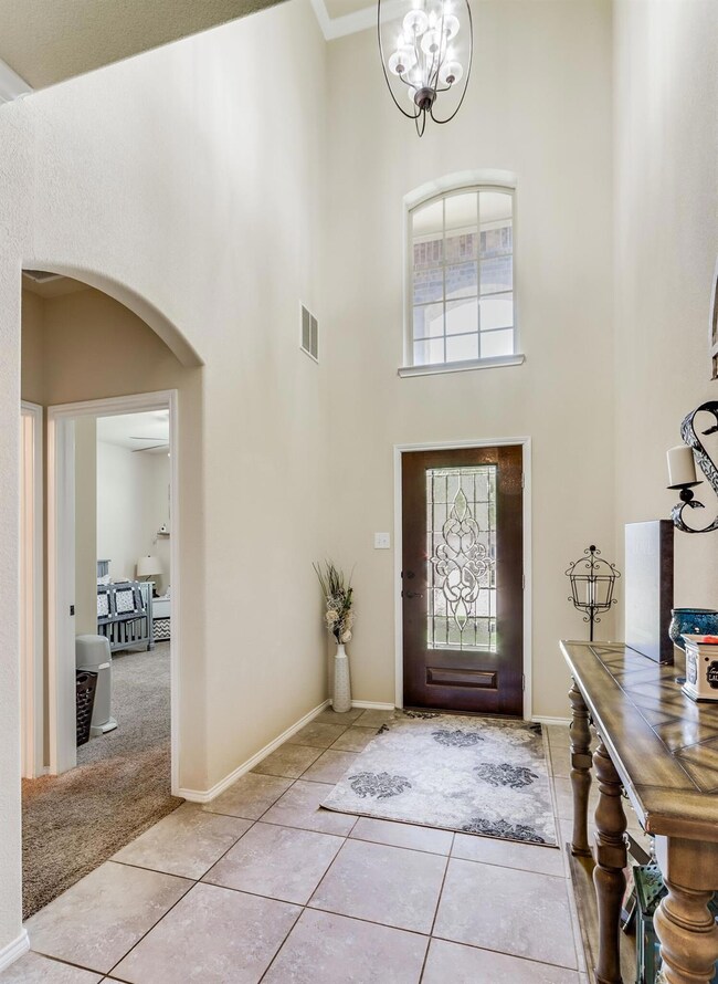 Grand foyer w/ office or 5th bedroom and guest bathroom.