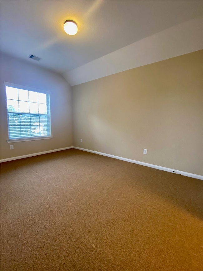 Large bedroom first floor with en suite bath and walk-in closet, not the primary bedroom.
