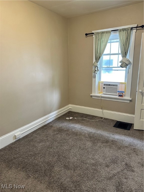 Carpeted empty room with cooling unit