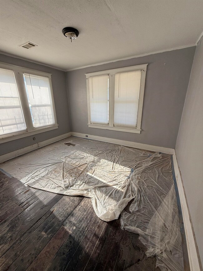 Unfurnished room with hardwood / wood-style floori