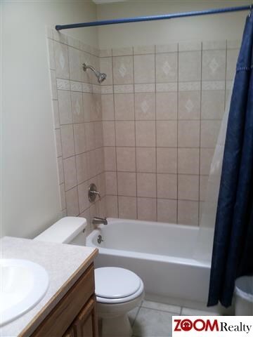 Lovely tile in the bathroom, sky light, linen closet....a well thought out plan.