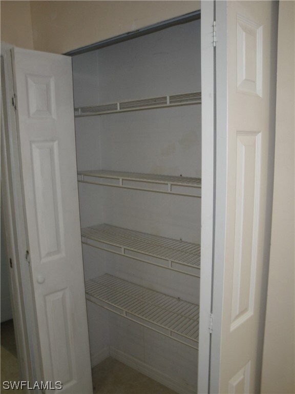 Four shelf pantry in the kitchen.