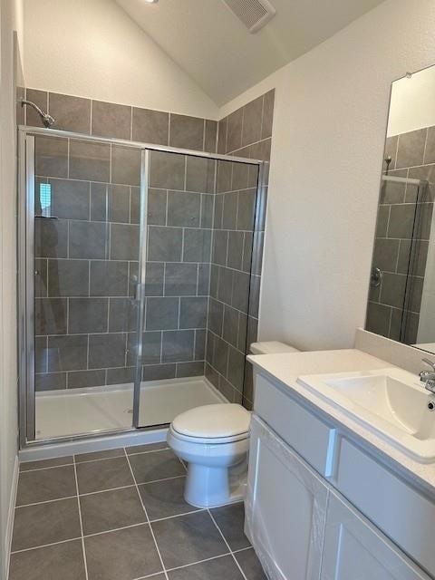 Bathroom with vanity, a shower stall, lofted ceil