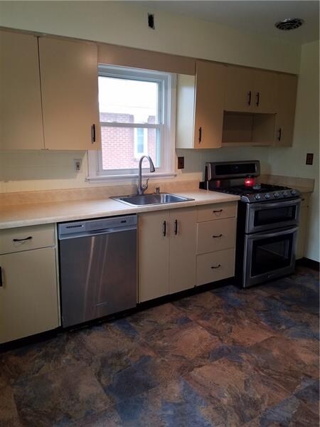 Neutral colored kitchen freshly painted and brand 