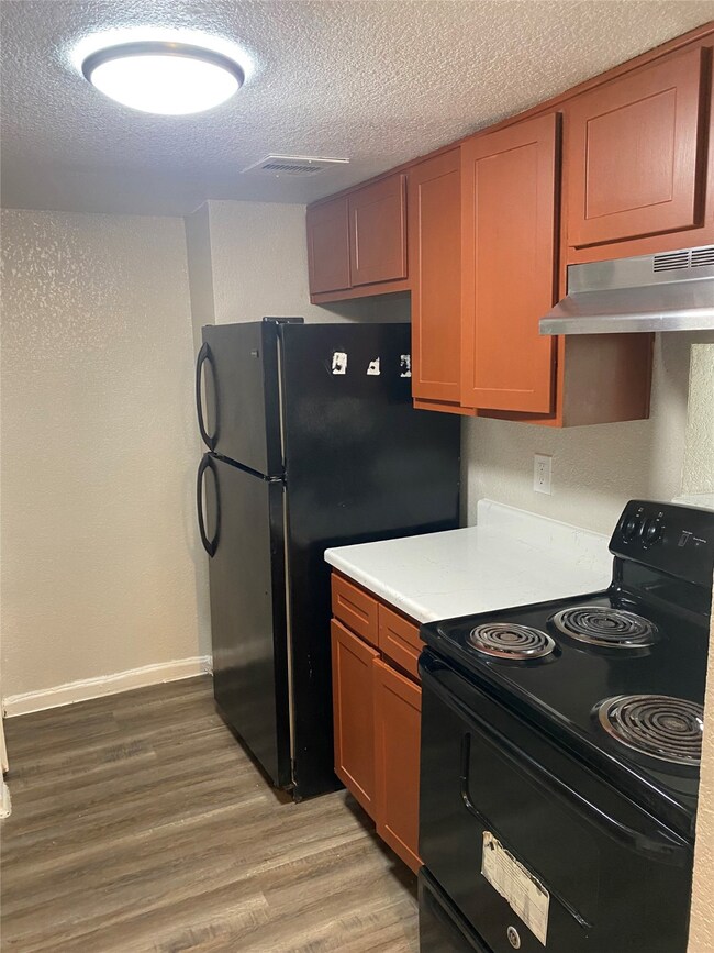 Kitchen with refrigerator and stove