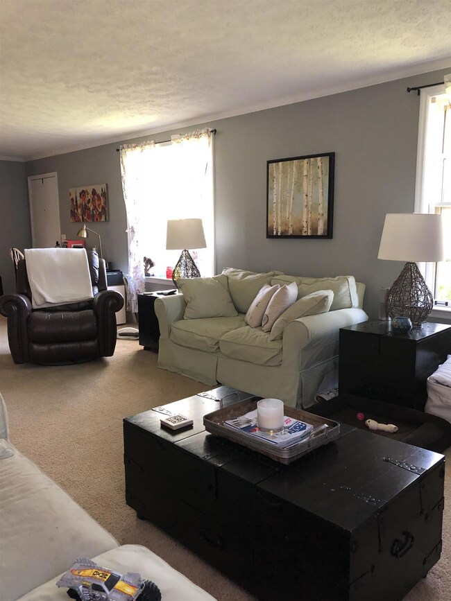 Another view of living room and large picture window