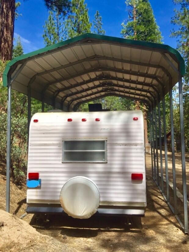 Snow cover above RV. Included in sale of property.