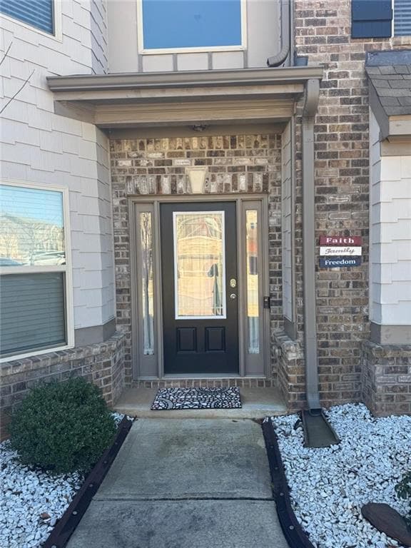 Property entrance with brick siding