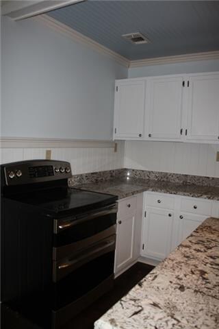 Here you see the awesome stainless double oven! The blue ceilings in this kitchen are beautiful and give it such charm!