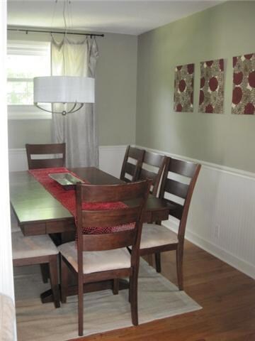 Located directly off the kitchen and living room, this is a warm, inviting space with bead-board framing the room.