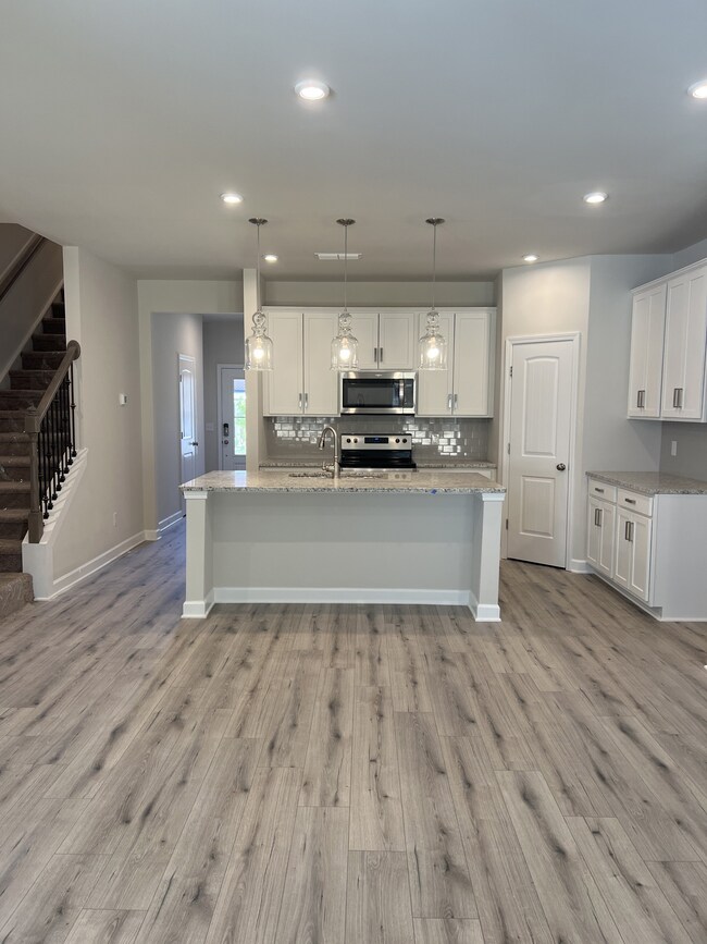 Open floor plan with kitchen open to the family room which is perfect for entertaining