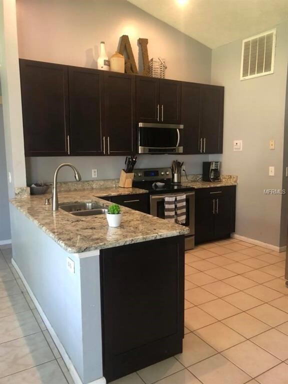 Open floor plan with volume/vaulted ceiling.  Upda