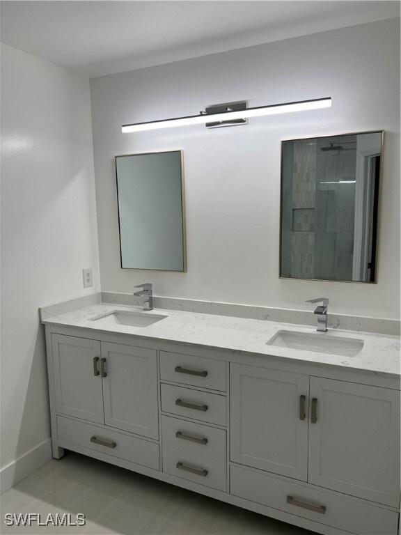 Master Bathroom with a shower and vanity