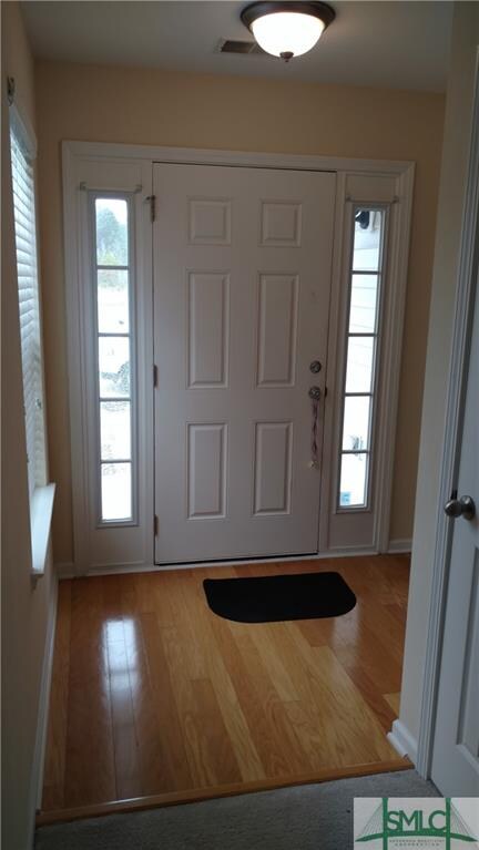 Foyer Entry with Hardwood Floor