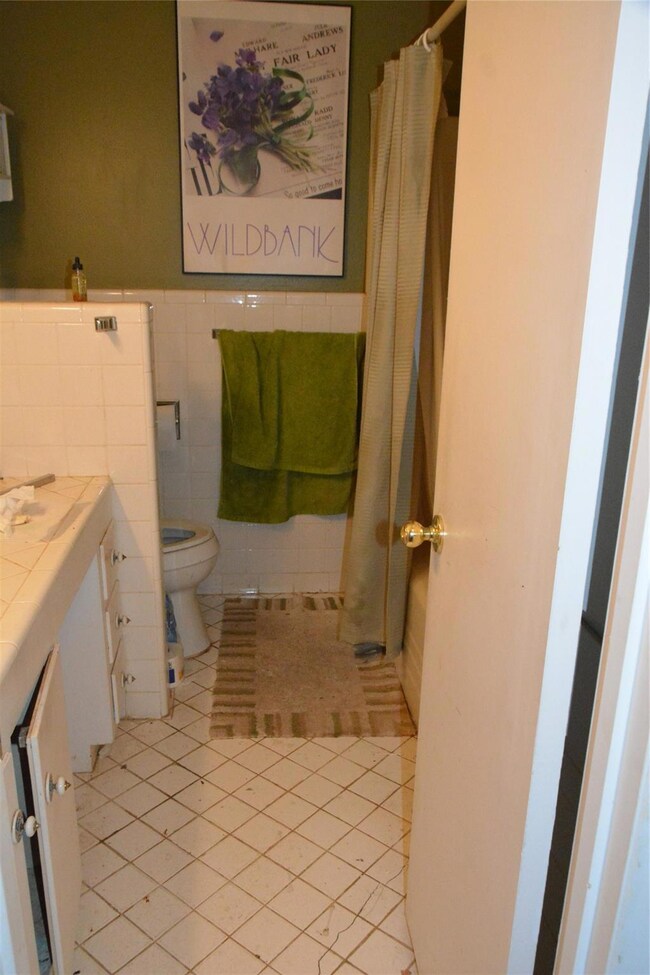 Bathroom featuring tile patterned floors, vanity, 
