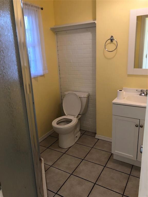 Bathroom featuring tile patterned floors, toilet, 