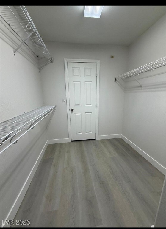 Spacious closet with wood finished floors