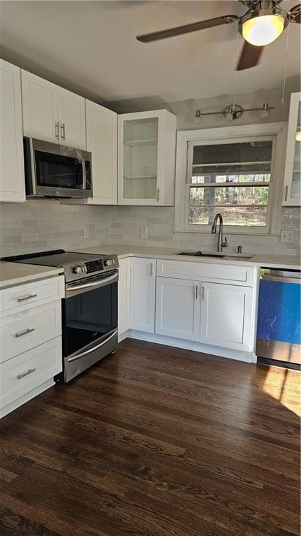 Kitchen featuring white shaker cabinetry, stainles