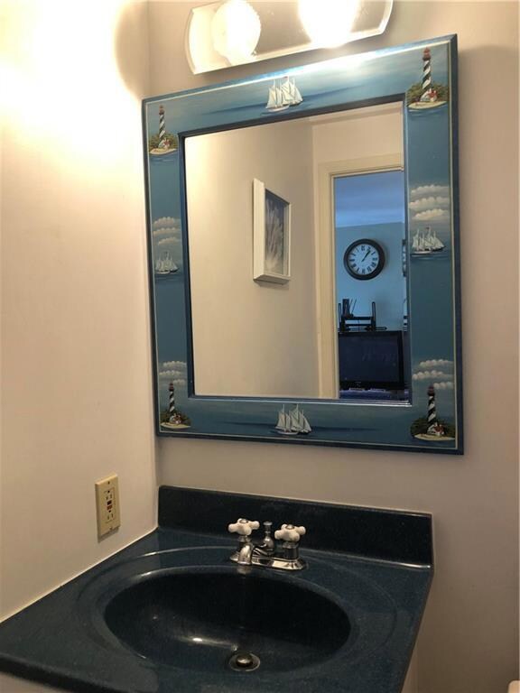 Full bath with nautical vanity.