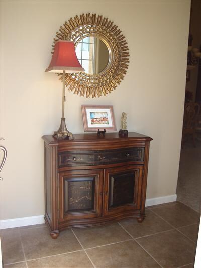 Entry foyer with 16 inch stone look tile floor.