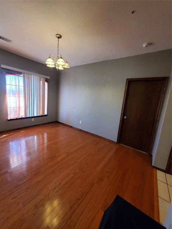 Spare room with hardwood / wood-style floors and a