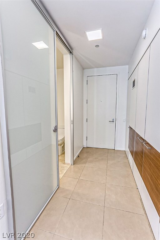 View of entry door into unit with Shower Bath to t