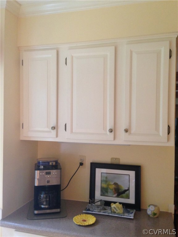 Coffee bar is tucked next to the eat-in bay window area off the kitchen.  Just a few steps to the sunroom ...