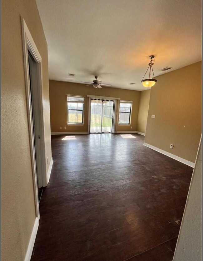 Spare room with dark wood-style floors and ceilin