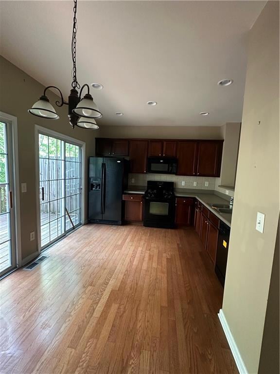 Kitchen featuring refrigerator, an inviting chande
