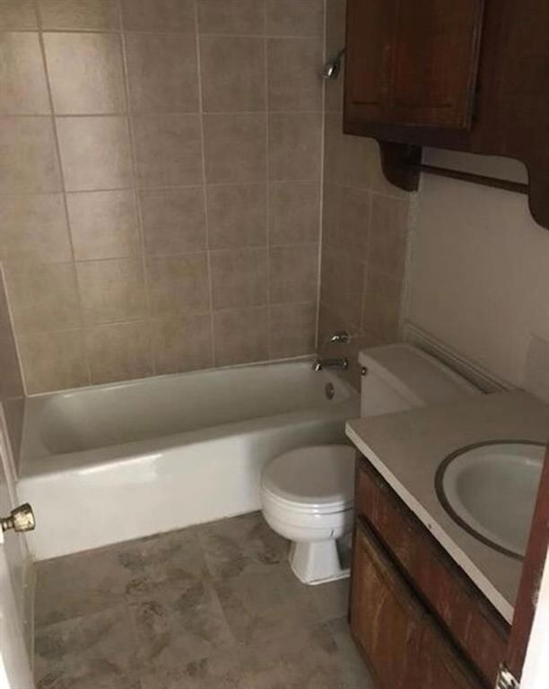 Full bathroom with tile floors, tiled shower / bat
