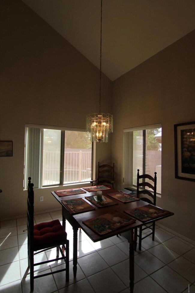 Sunny dining room connects to kitchen.
