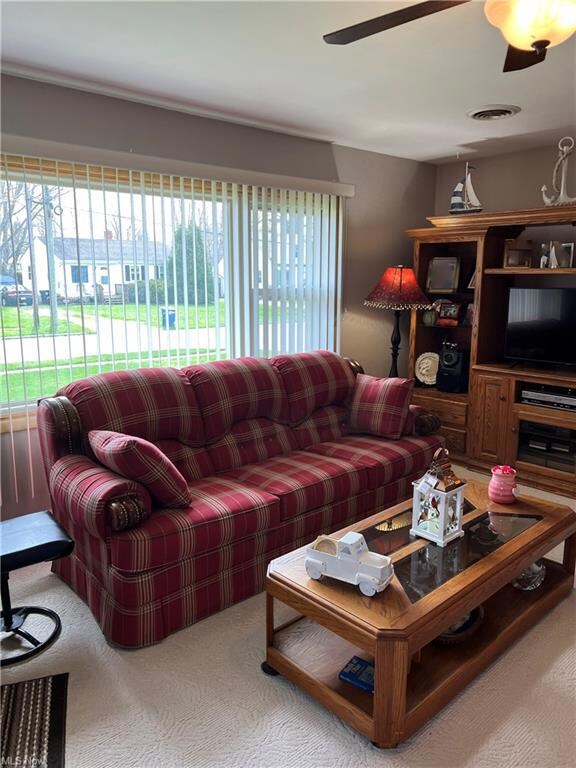 Living room 19 x 15 with ceiling fan.