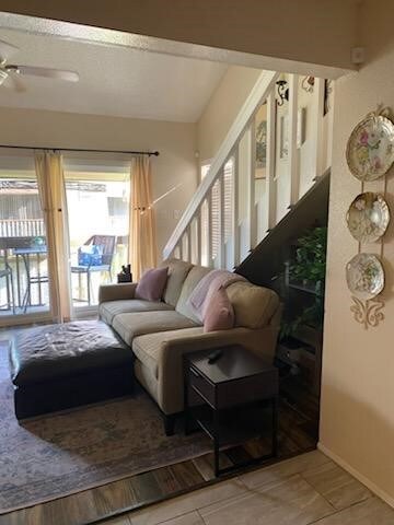 Glass wall along balcony and stairs to lofted bedr