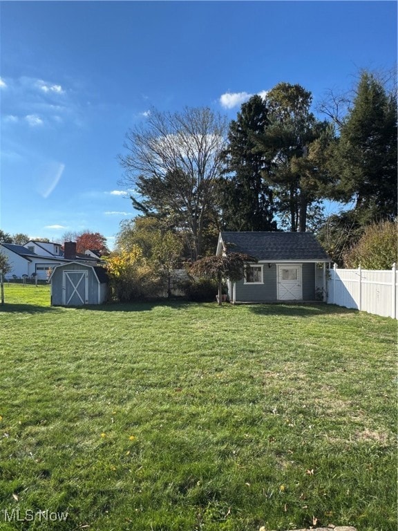 View of yard featuring a storage unit