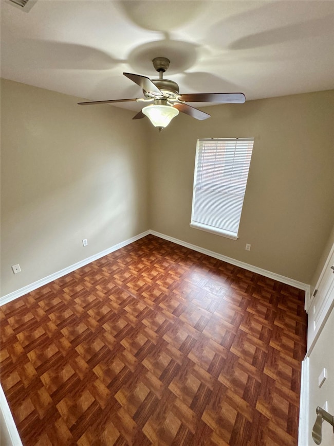 Unfurnished room featuring baseboards