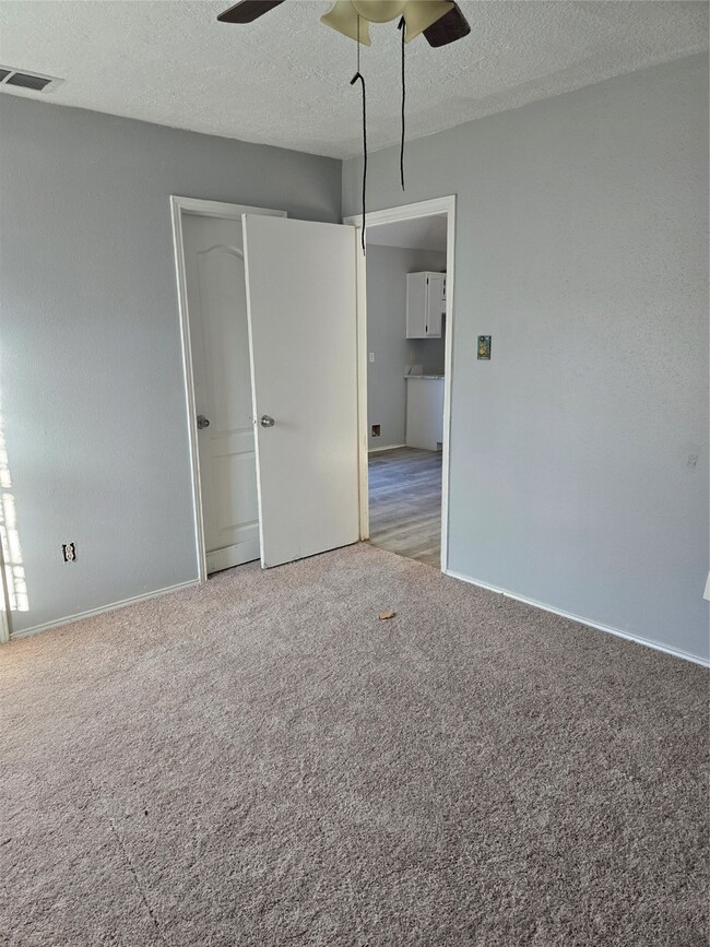Bedroom #1 (Unit 1) New Carpet, Fresh Paint (October  2025) Nice Closet Space & Entry Door to Full Bath w Updates.