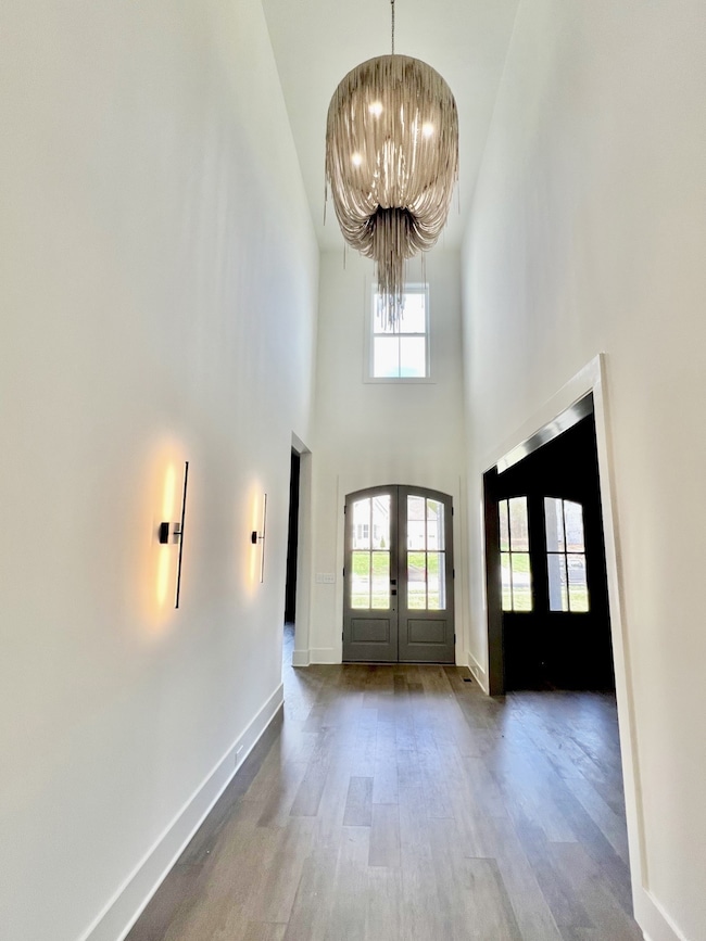 The moment you step inside, you're greeted by a grand foyer that sets the stage for the elegance that pervades every inch of this home. All photos of similar homes & showcase structural modifications & upgrades.