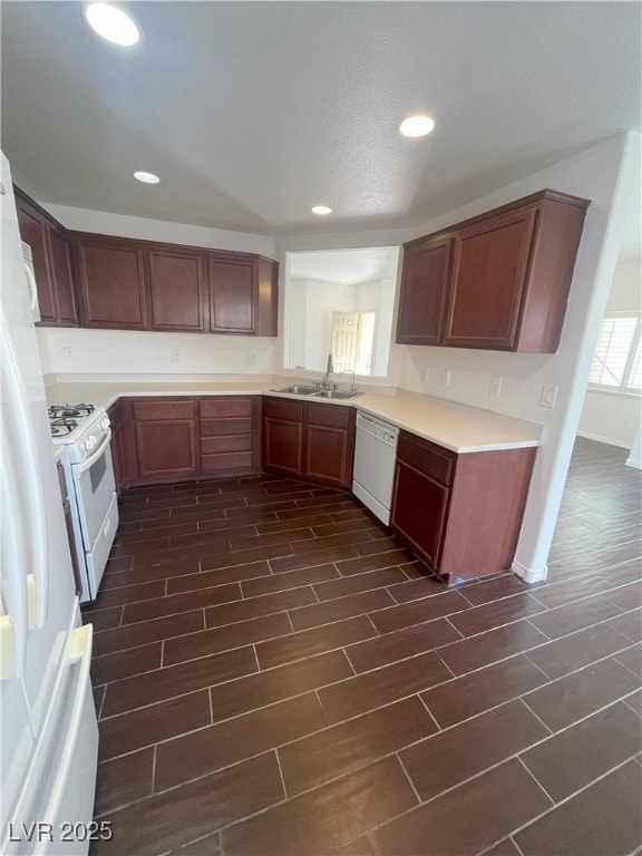 Kitchen with wood finish floors, recessed lighting