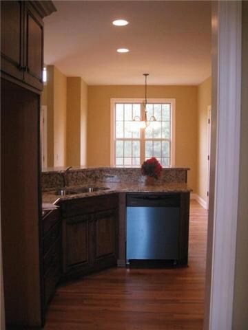 The architecture in this home is fabulous. In addition to the fabulous dining area of the home, you have a breakfast room just beyond the snack bar, complete with a large window overlooking the greenery outside. 